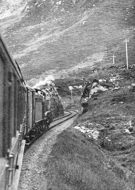 A London and North Eastern Railway train passing along a stretch of line between the stations of Arisaig and Mallaig