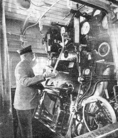 AT THE CONTROLS of a German locomotive