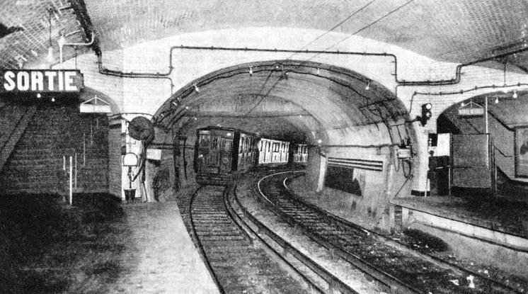 ON THE PARIS UNDERGROUND. A train entering the station of Place d'Italie
