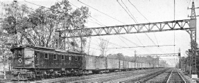 MAIN LINE ELECTRIC FREIGHT LOCOMOTIVE AND TRAIN ON THE NEW YORK, NEW HAVEN AND HARTFORD RAILROAD