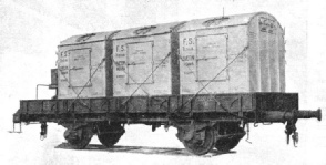 Three refrigerator containers loaded on to a rail truck