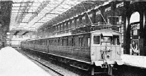 “OVERHEAD” ELECTRIC TRAIN ON THE BRIGHTON SECTION OF THE SOUTHERN RAILWAY