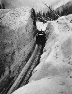 A WEDGE SNOW PLOUGH then cleans the cut