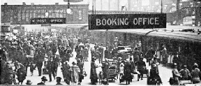 A HOLIDAY SCENE AT LIVERPOOL STREET STATION