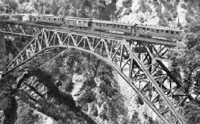 THIS MAGNIFICENT STEEL ARCH carries the Lötschberg Railway across the Bietschtal Gorge