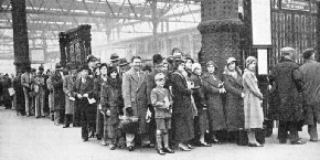 a typical crowd queuing up for a holiday train at Waterloo Station