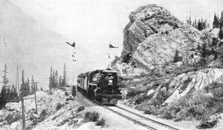 THROUGH THE ROCKIES, the express approaches Revelstoke in British Columbia