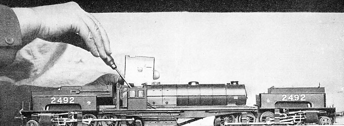 MINOR ADJUSTMENTS being made to a miniature 2-8-0+0-8-2 Garratt locomotive