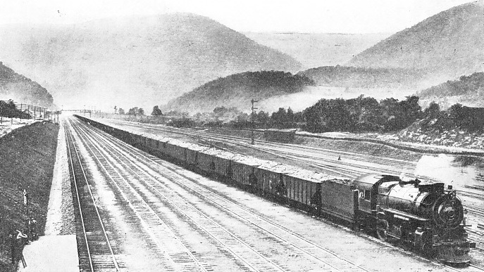 A LONG FREIGHT TRAIN of one hundred coal wagons on the Middle Division of the Pennsylvania Railroad system