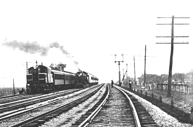 A NECK-AND-NECK RACE BETWEEN ELECTRICALLY AND STEAM DRIVEN TRAINS