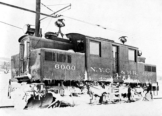 HE ELECTRIC LOCOMOTIVE AFTER ITS CONTEST WITH THE SNOWDRIFTS