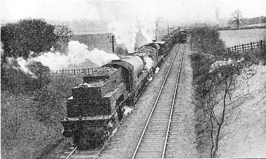 “BANKING” A HEAVY COAL TRAIN UP A 1 IN 40 GRADIENT ON THE LNER